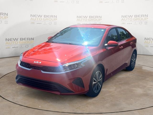 2024 Kia Forte LXS in Fire Orange — front three-quarter view
